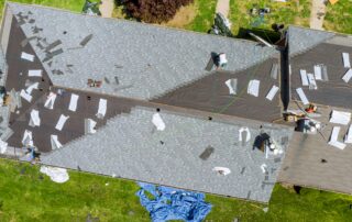 Roof repair in progress on residential home with partial shingle replacement, illustrating roof repair vs roof replacement decision and damage assessment in Florida, Castaways Roofing