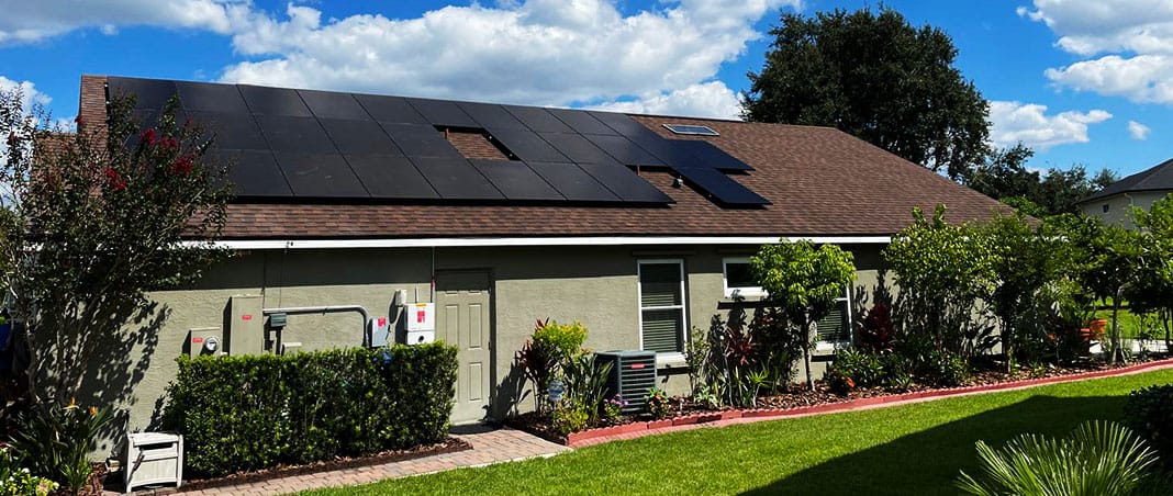 Residential rooftop solar panel installation on asphalt shingle roof of Florida home demonstrating solar-ready roofing integration and renewable energy system by Castaways Roofing